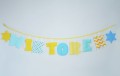 Girlanda z imieniem dziecka 8 liter + 2 dekory miętowo-żółta